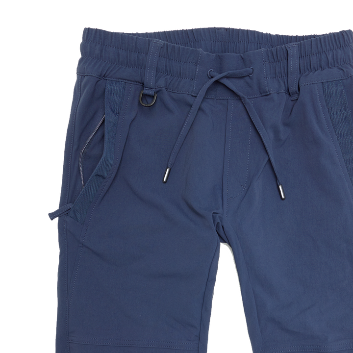 Närbild på Spidi Mc-Byxor Moto Jogger Blå som visar detaljer som dragsko, fickor och robust design för motorcykelentusiaster.